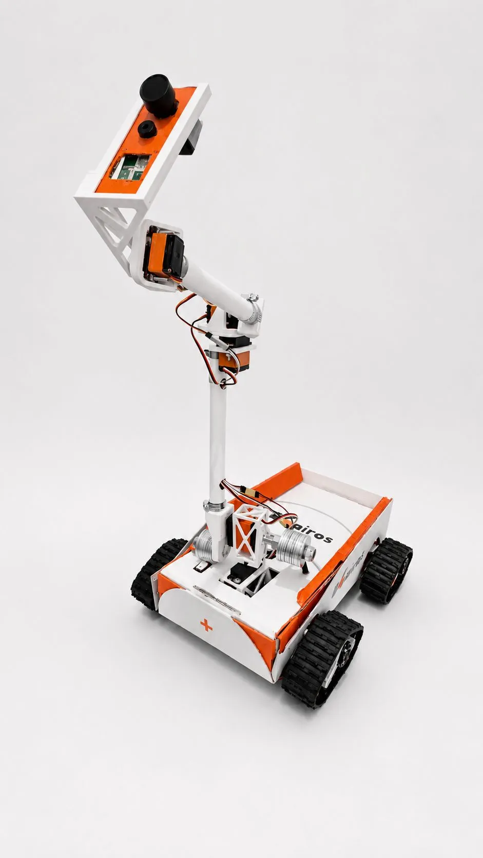 The robot with its camera arm raised high above the chassis